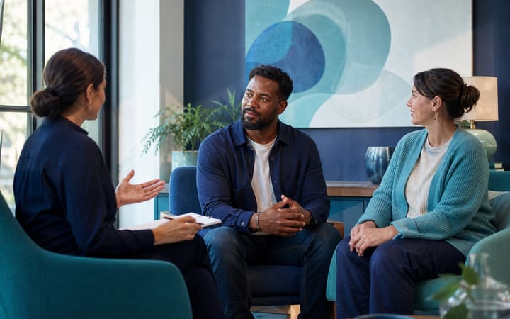 Adult discussing cocaine recovery options with a health professional in a calm, supportive clinic